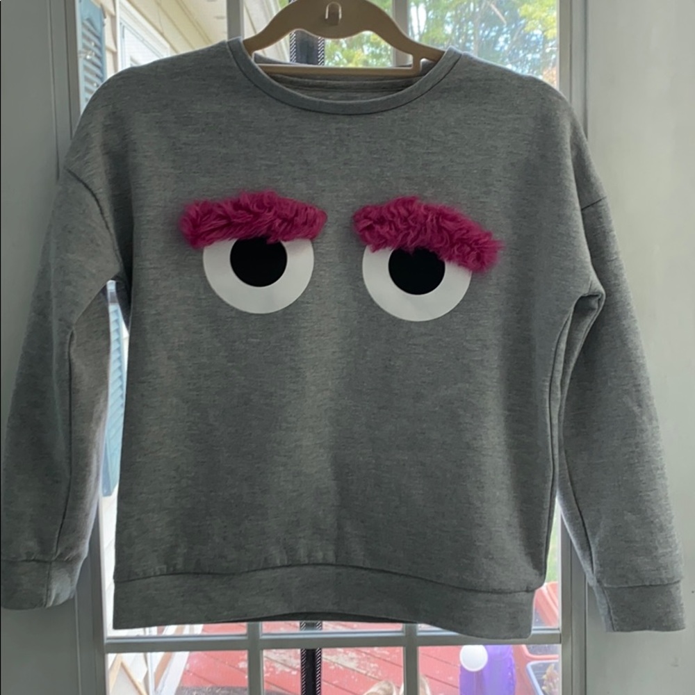 YD Kids gray sweatshirt with furry eye detail